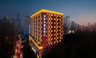 A city hotel is shown in a time-lapse video at night, featuring neon lights on all sides at Guangzhou Zhujiang New Town Ausotel Smart Hotel, Canton Fair Free Shuttle