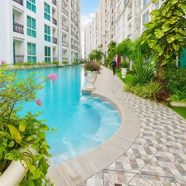 รูปภาพของอพาร์ทเมนต์โอลิมเปียในตัวเมืองพัทยา สระว่ายน้ําชุมชนวงแหวน