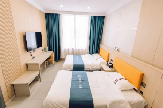 UP Huayi Hotel (Jixi Shi Railway Station Wanda Plaza)