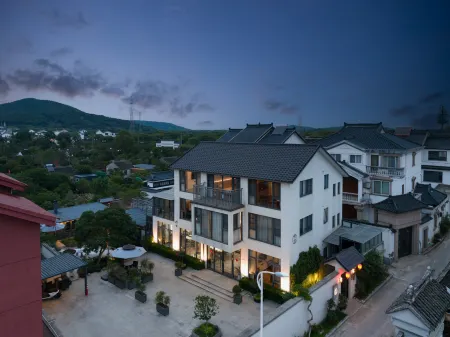 Suzhou Village inn Отели рядом с достопримечательностью «Shanghai Customs College Suzhou Branch»