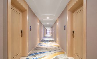 A long hallway with carpeted floors and wood-paneled walls at both ends at Vienna International Hotel (Shanghai Pudong Airport)