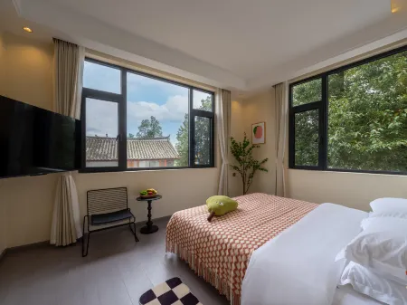 Snowy mountain Photography Hotel Отели рядом с достопримечательностью «Lashihai Wetland Park»