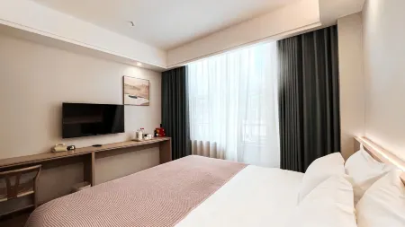 Meitan Qicheng Hotel Отели рядом с достопримечательностью «Meitan International Hotel Hot Spring»