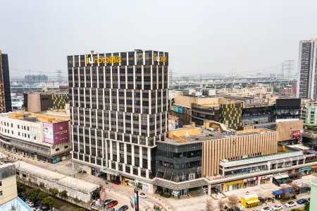 IU Hotel (Zhongshan Xiaolan Parkway Plaza) Отели рядом с достопримечательностью «Xiaolangang International Huogui Shipside»