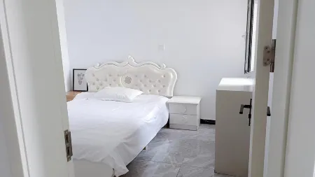 Orange Apartment Отели рядом со станцией Junan Railway Station