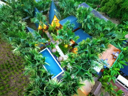 Olive Homestay in Jinghong, Xishuangbanna (located in the Dai Ethnic Minority Park Scenic Area) Отели рядом с достопримечательностью «Menghanman Tingfota Temple»