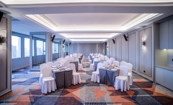 The ballroom is arranged with tables and chairs for events or functions at Mercure Guangzhou Beijing Road Pedestrian Street Hotel