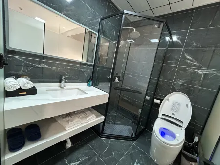 Xinbo Grand Hotel Отели в г. Юншань