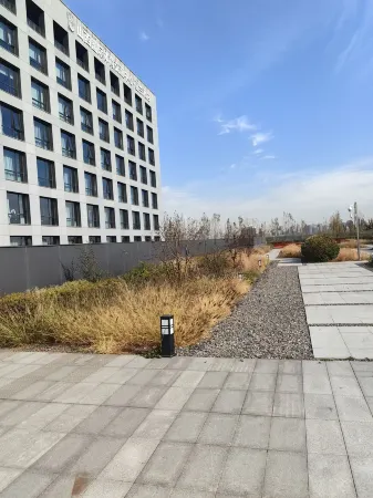 Shanxi International Sports Exchange Center. Hotel MoMc (Red Lantern Stadium) Отели рядом с достопримечательностью «Taiyuan Botanical Garden»