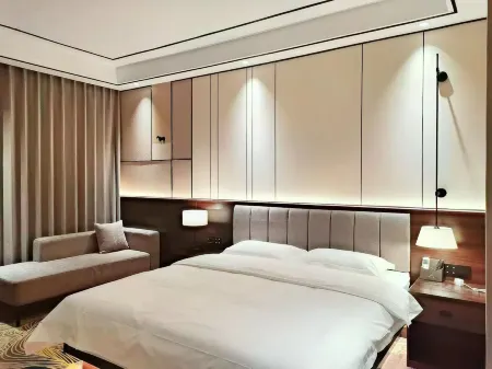 Greenland Mansion Hotel, Weinan Отели в г. Цзюйнань