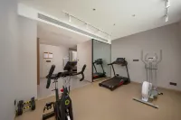 Yilong Ruiyun Hotel (Xinyang Railway Station Tianrun Square Branch) - ที่มีฟิตเนส