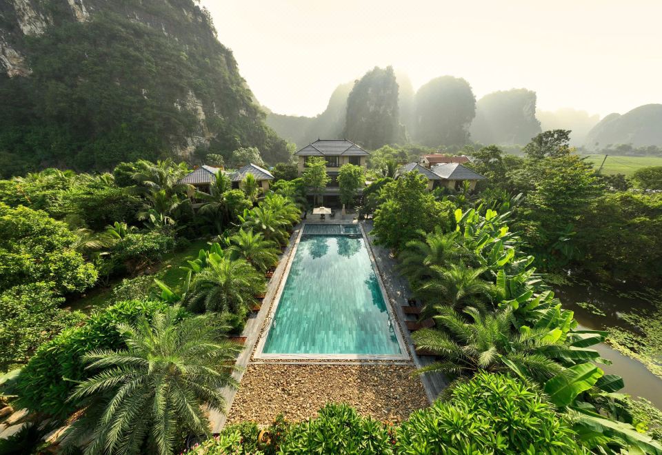 Bliss Tam Coc Resort Ninh Binh luxury eco chalets and pool