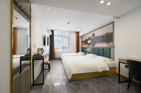 Ruining Hotel ( Xiangyang Gucheng North Street Branch) Отели рядом с достопримечательностью «Gulou Culture Square»