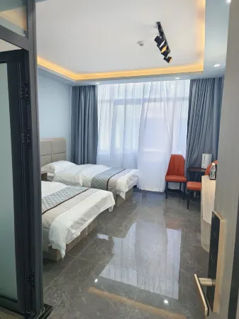 Xingchen Hotel (Coqen) Отели в г. Цоцинь