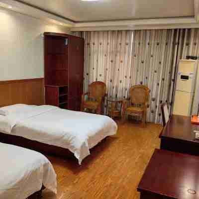 Dingyuan New Start Business Hotel Rooms