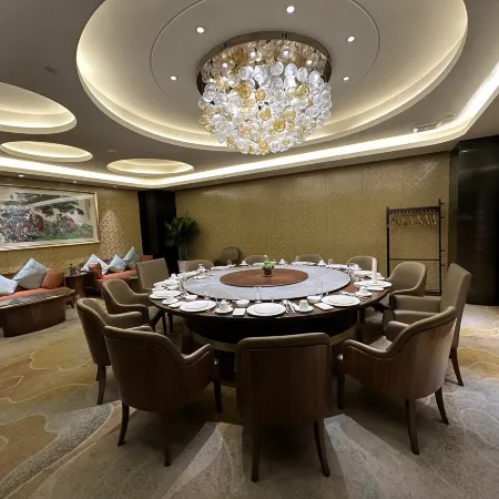 Li Cai Tian Qi Hotel
