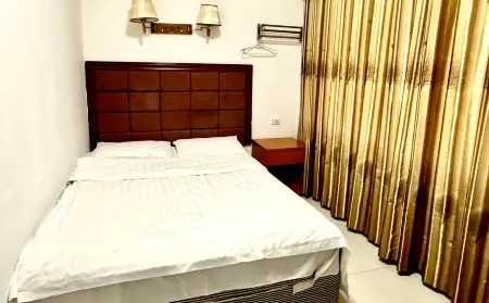 Wusheng Hexin Business Hotel Отели в г. Вушен