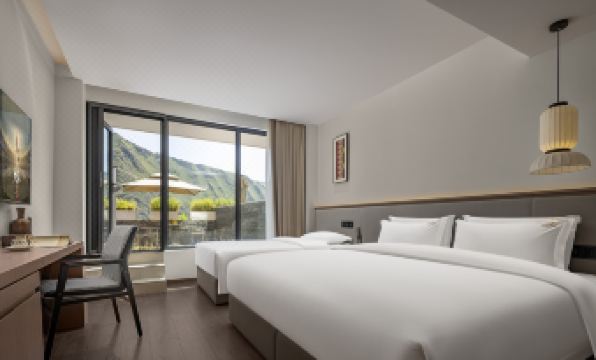 Wolian Huayin Hotel in XinduqiaoKanding