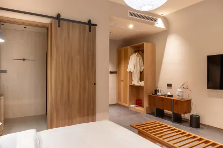 Qieman Tangquan Health and Wellness Homestay Hot Spring Hotel (Xinzhou Ancient City Branch) Отели рядом с достопримечательностью «Xiurong College»