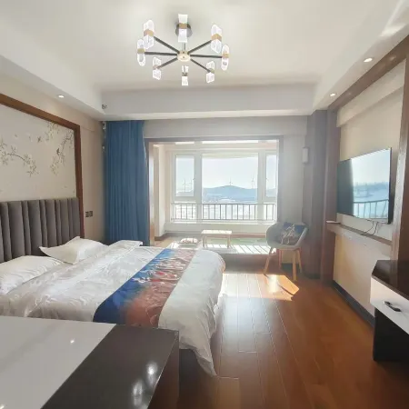 Xinyue Bay Seaview Apartment Hotel (Shibei Bay Dream Water Park Branch)