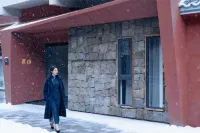 Jiuzhaigou · Mistshroud Mountains & Sunset Glow Snowscape · Sukoon Village Hotels in Jiuzhaigou
