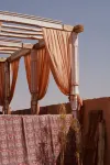 CAMEL SHADOW IN WEST