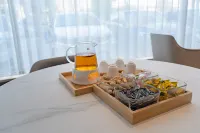 Borrman Hotel (Binhai Qichezhan Yigao Guangchang) Hôtels à : Binhai