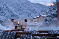 Jiuzhaigou · Mistshroud Mountains & Sunset Glow Snowscape · Sukoon Village Hotels in Jiuzhaigou