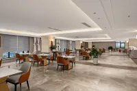 Rezen Huanxi Hotel (Huangchuan Sports Center Branch) - 주차장