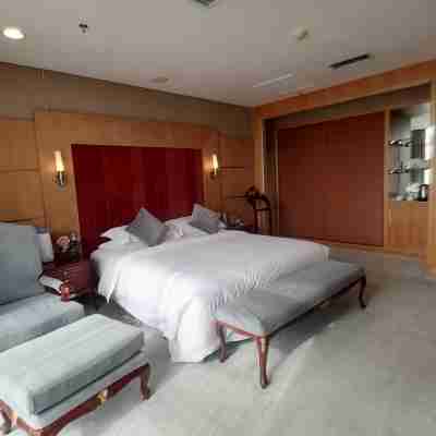 Jiugang Hotel (Jiayuguan Guancheng Fangte Phase 2 Huaboyuan) Rooms