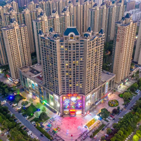 May Boutique Hotel (Xinyang East Railway Station Evergrande Plaza)