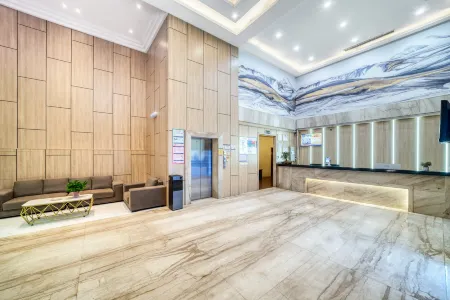 Aikesi Fashion Hotel (Suixi Real Leather World Shop) Отели рядом с достопримечательностью «Luzhong Ancient Tree»