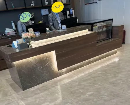 THE HOME HOTEL Отели рядом с достопримечательностью «Yantai Nanshan University (Nanshan Middle Road)»