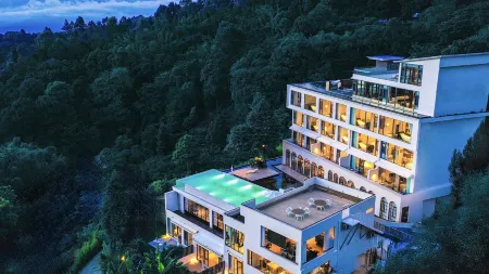 XISHUANGBANNA MUKELAN Hotel Отели в г. Менхай