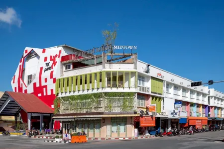 Santisookmidtown Отели рядом с достопримечательностью «Lak Muang Bureau of Monks»