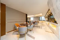 Magnotel Business Hotel (Shenyang Olympic Center Subway Station Wanda Plaza) - فطور