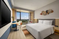 HOLIDAY INN EXPRESS NALATI Отели в г. Синьюань