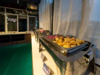 Mijng Qiyuan Minority Theme Hotel - servizio colazione