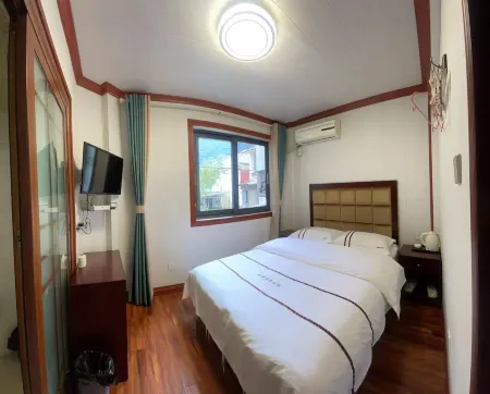 Wenchuan Erma Business Inn Отели рядом с достопримечательностью «Baihua Bridge Relic Site»