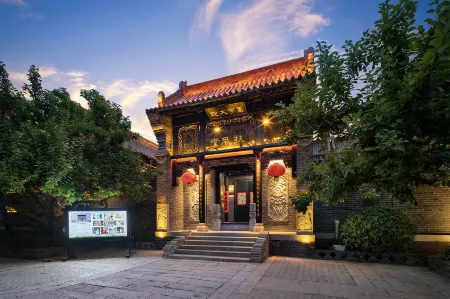 Wanjia Courtyard Hotel (Taierzhuang Ancient City Scenic Area) Отели рядом с достопримечательностью «Zaozhuang Technician College Tai'erzhuang Branch»