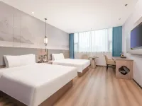 Huaju Hotel (Wenfeng World Store, Middle Jianghai Road, Qidong) Hoteles en Qidong
