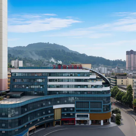 Jiulong Yipin Hotel (Xifeng High-Speed Railway Station Shizi Street Plaza)