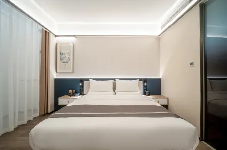 Baizhu Hotel (Taixing Middle School Branch on Zhenhuai Road) Отели рядом с достопримечательностью «Drum Tower Square»