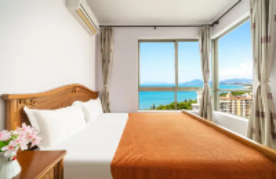 Sanya Red Orange Blue Dragonfly Homestay Hotel (Sanya Bay Haiyue Square Branch)