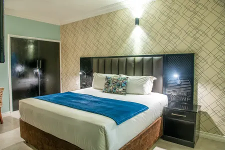 New Ambassador Hotel Отели в г. Хараре