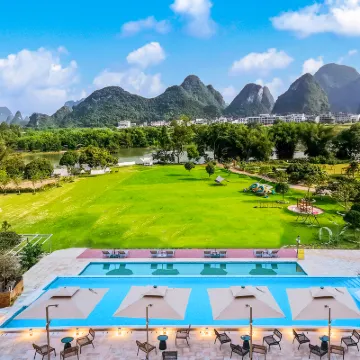 รีสอร์ทหยู่หยวน หยางซั่ว (แกลเลอรี่ซือหลี่ & แม่น้ำหยู่หลง) โรงแรมใกล้อูฐข้ามแม่น้ำ