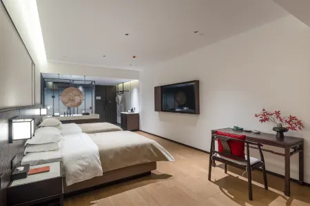 Qianna Qianxun Hotel (Xinfei Avenue Branch) Отели в г. Синьсян