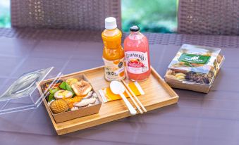 The table is set with a variety of food and drinks, including beer at Hotel the Grang Jungmun