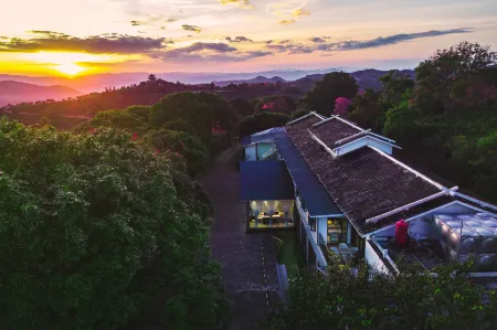 Pu'er Tea Garden Resort Hotel(Pu'er Tea Expo Garden) Отели рядом с достопримечательностью «Rhino Land of The Pu'Er National Park»