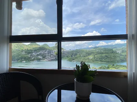 Linjiang Waterfall Viewing Inn Отели в г. Гучжан